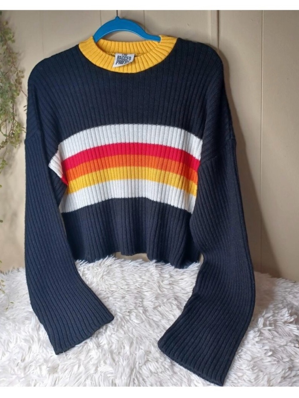 The Ragged Priest black knit sweater with yellow, red, yellow, white stripes